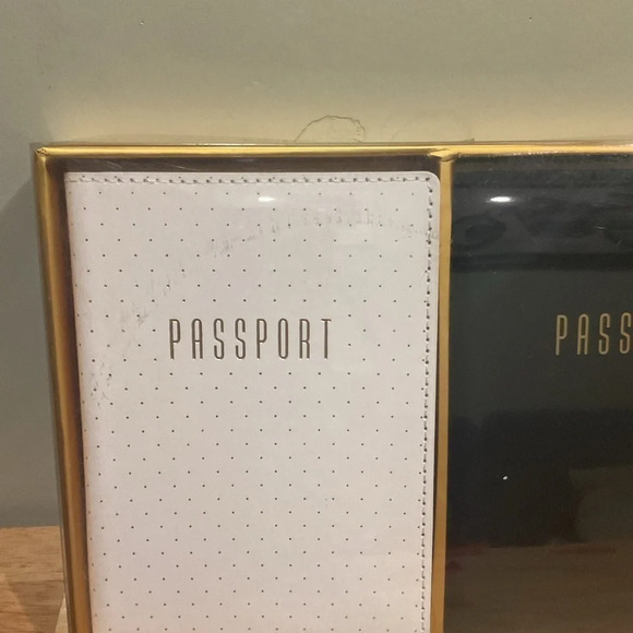 Box set with 2 passport holders. 1 black and 1 white. Brand new in box. - Picture 6 of 11